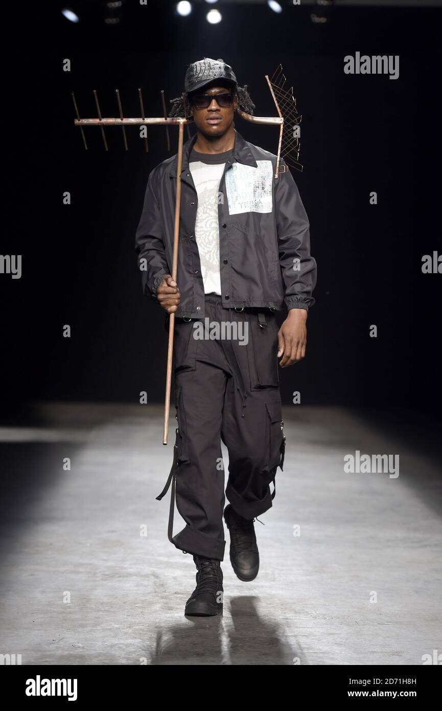 A model wears a creation by Liam Hodges during the MAN fashion show, during the British Fashion Council's London Collections: Men at the Old Sorting Office in London. Stock Photo