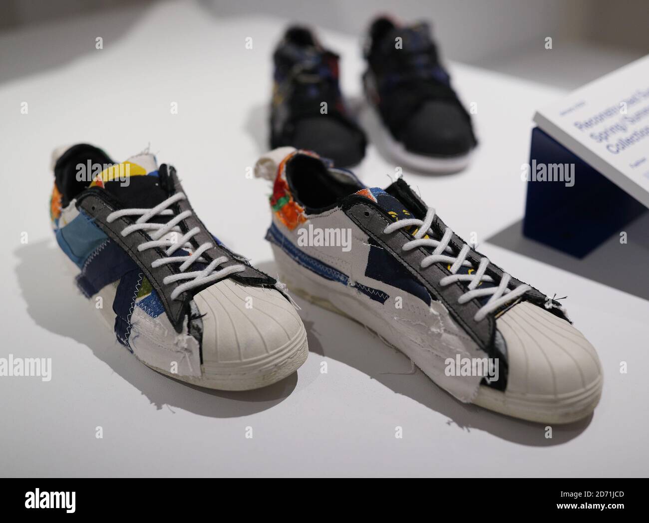 Second-hand Adidas Superstar sneakers, part of the Reconstructed Superstars,  Spring/Summer 2020 collection by designers Helen Kirkum and Bethany  Williams, at a photo call for the Beazley Designs of the Year exhibition at