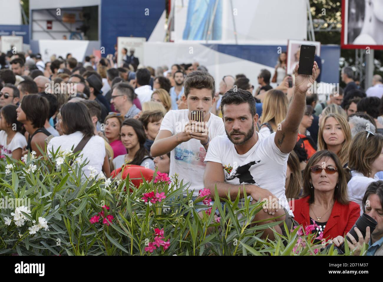 Fans look on at the premiere of A Bigger Splash, at the 72nd Venice