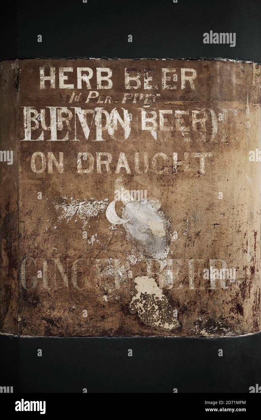 Old painted sign advertising herb beer, Burton beer, ginger beer and
