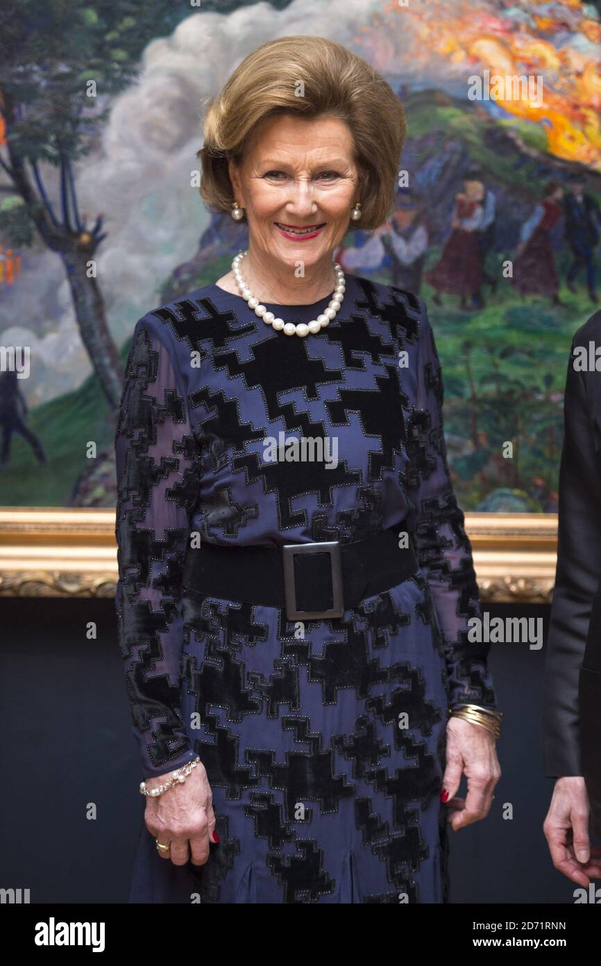 Her Majesty Queen Sonja of Norway pictured in front of 'Midsummer Eve Bonfire', during a visit to the Nikolai Astrup exhibition, at  Dulwich Picture Gallery in south London. Stock Photo