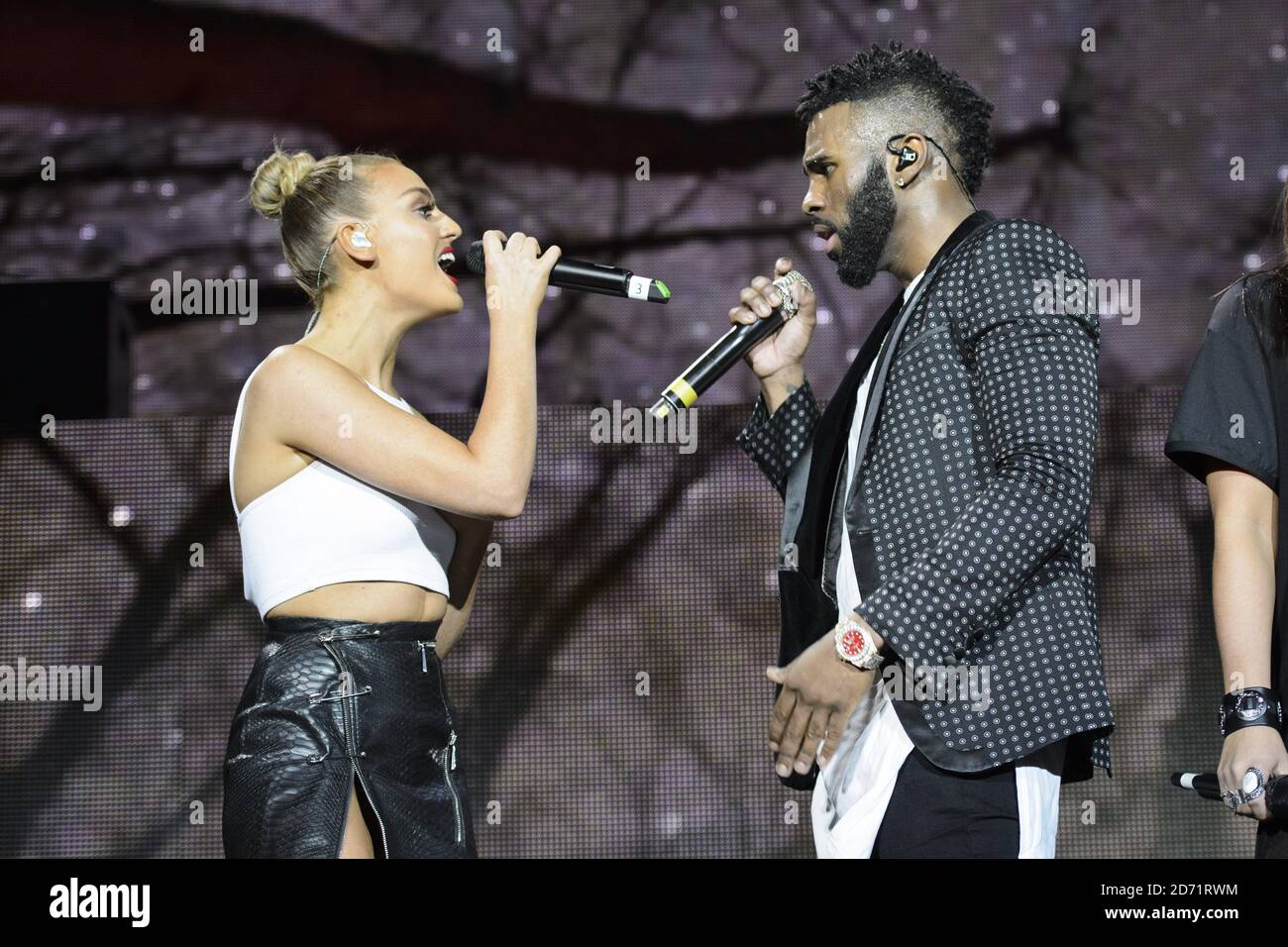 Perrie Edwards of Little Mix performing with Jason Derulo at the O2 Arena  in east London Stock Photo - Alamy
