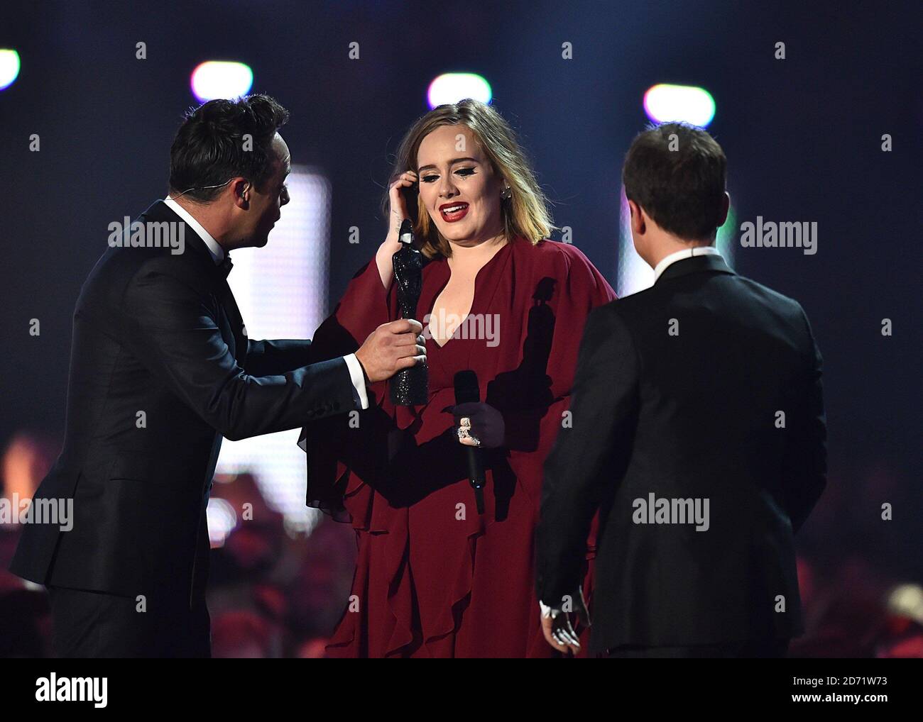 Adele collects the Global Success Award from Ant and Dec on stage during the 2016 Brit Awards at the O2 Arena, London. Stock Photo