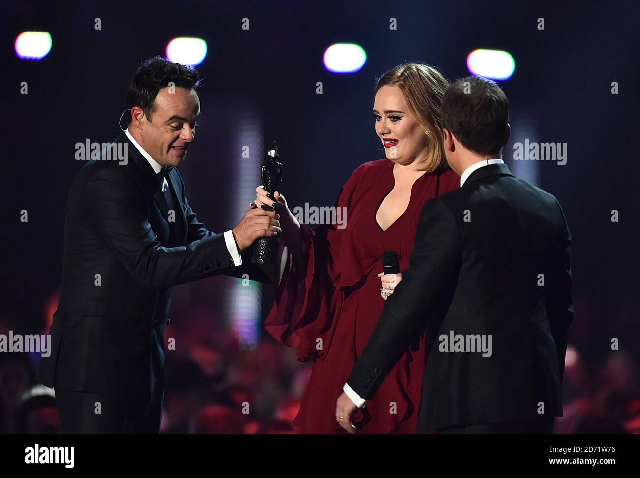 Adele collects the Global Success Award from Ant and Dec on stage during the 2016 Brit Awards at the O2 Arena, London Stock Photo