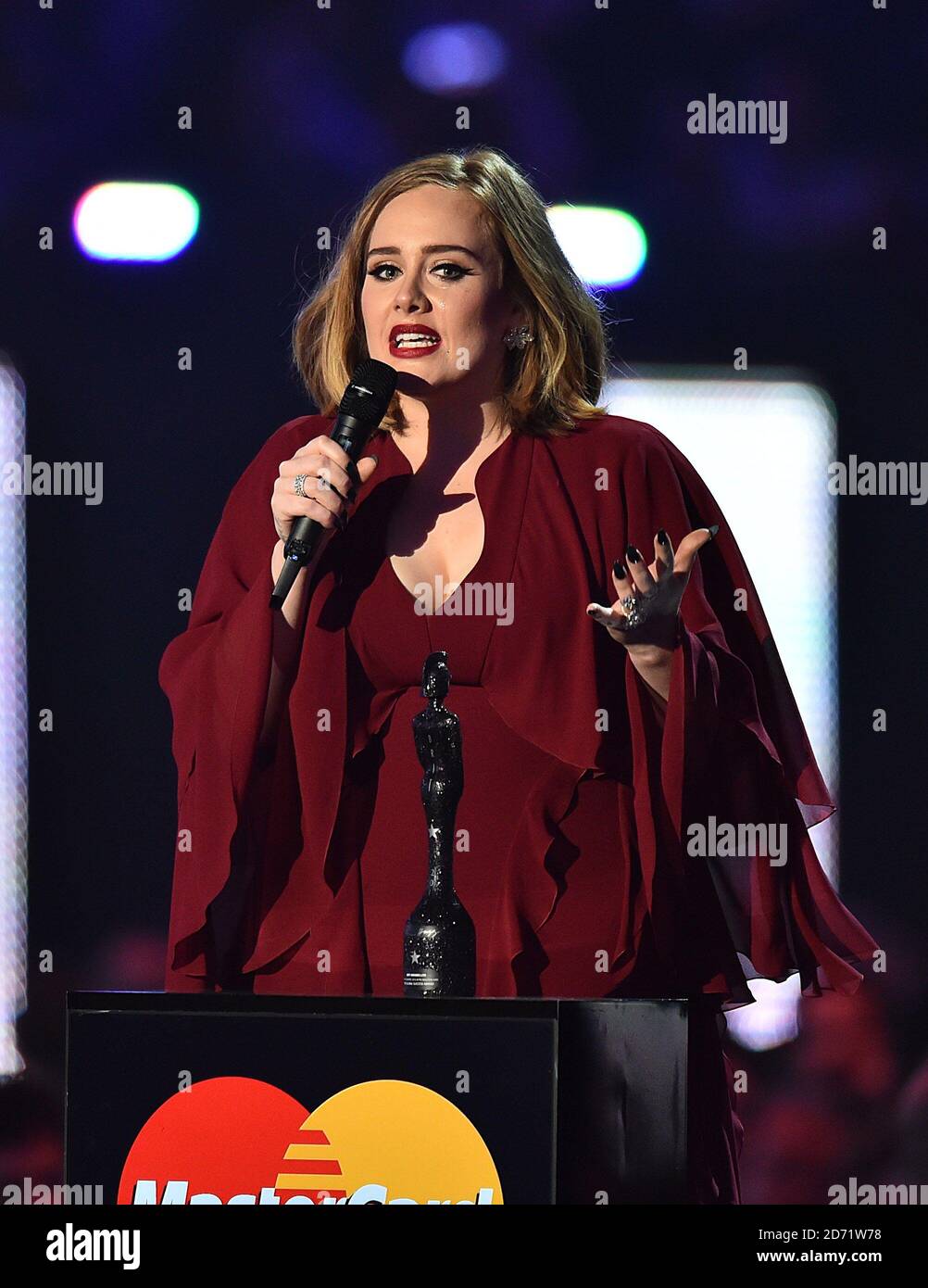 Adele collects the Global Success Award from Ant and Dec on stage during the 2016 Brit Awards at the O2 Arena, London Stock Photo