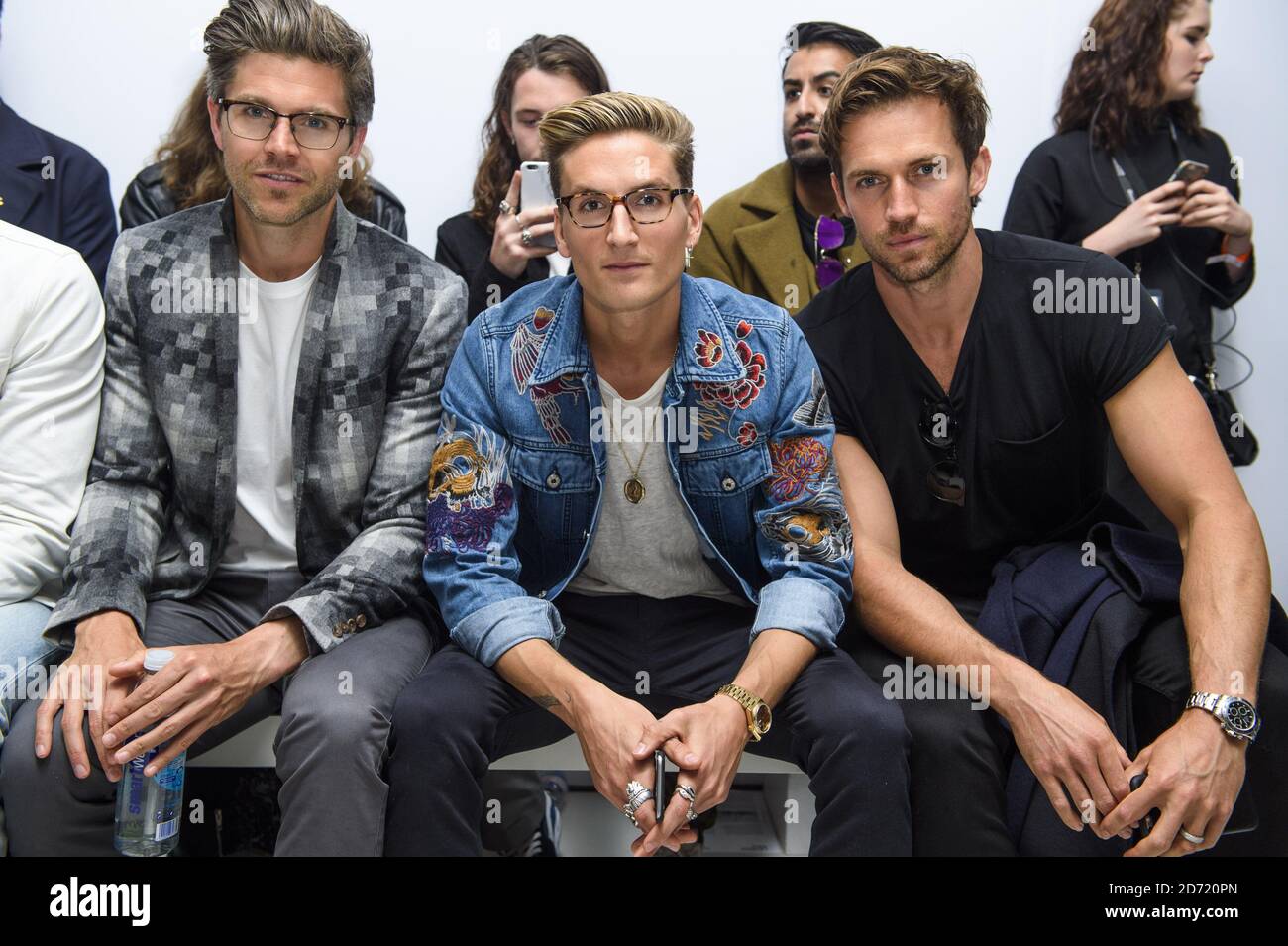 Darren Kennedy, Oliver Proudlock and Andrew Cooper on the front row at the Christopher Raeburn fashion show, held at the BFC Venue on 180 Strand as part of London Collections: Men,  Stock Photo