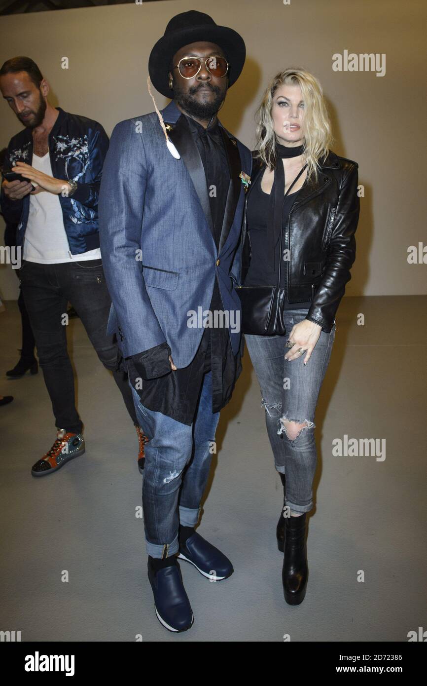 Fergie Duhamel and will.i.am on the front row during the Gareth Pugh Spring/Summer 2017 London Fashion Week show, held at the BFC Show Space, Brewer Street Car Park, London. Picture date: Friday September 16, 2016. Photo credit should read: Matt Crossick/ EMPICS Entertainment. Stock Photo