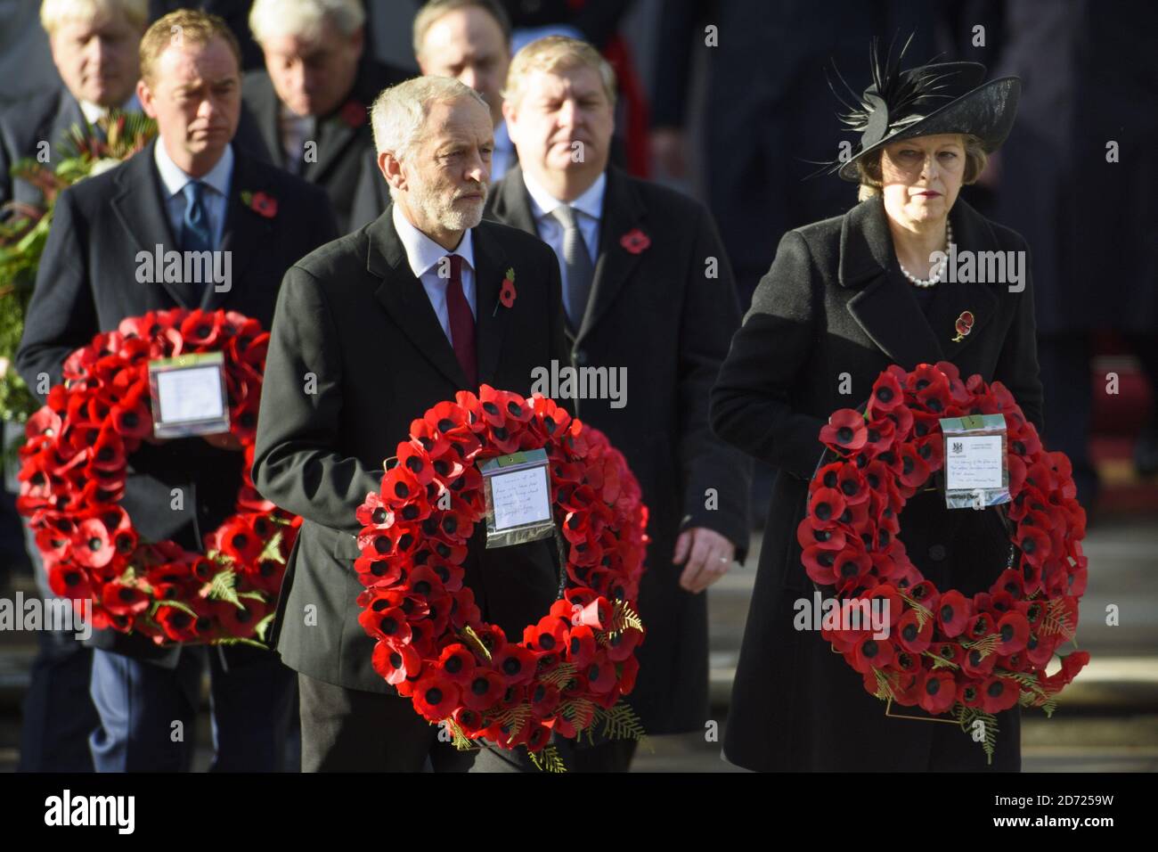 Labour leader Jeremy Corbyn, Prime Minister Theresa May and Liberal Democrat leader Tim Farron during the annual Remembrance Sunday Service at the Cenotaph memorial in Whitehall, central London, held in tribute for members of the armed forces who have died in major conflicts. Picture date: Sunday November 13th, 2016. Photo credit should read: Matt Crossick/ EMPICS Entertainment. Stock Photo