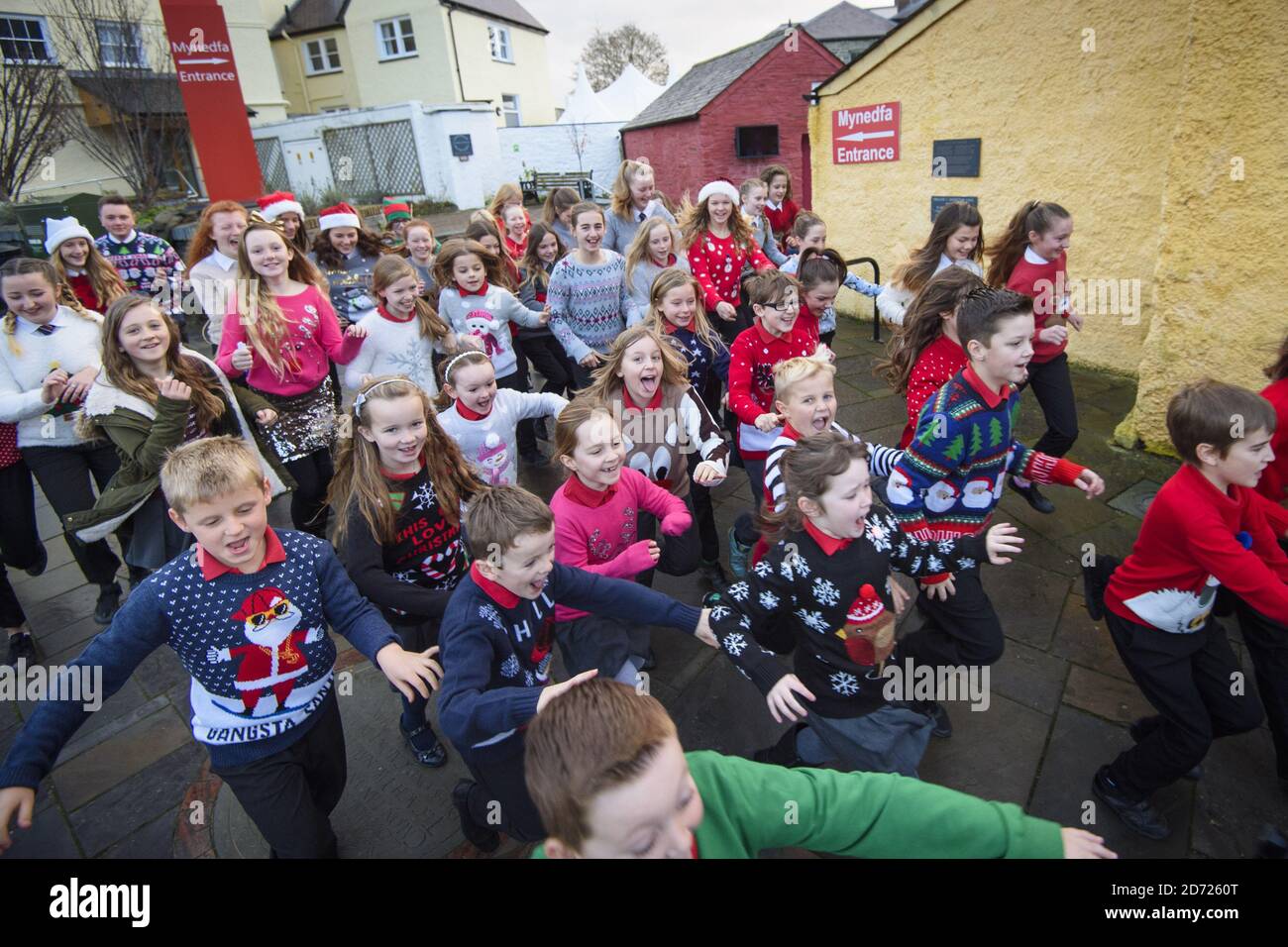 Local schoolchildren wear Christmas jumpers to school, as Cardigan in Wales officially changes its name to Jumper, to support Save the Children's Christmas Jumper Day, taking place this Friday 16th December. Picture date: Wednesday December 14th, 2016. Photo credit should read: Matt Crossick/ EMPICS Entertainment. Stock Photo