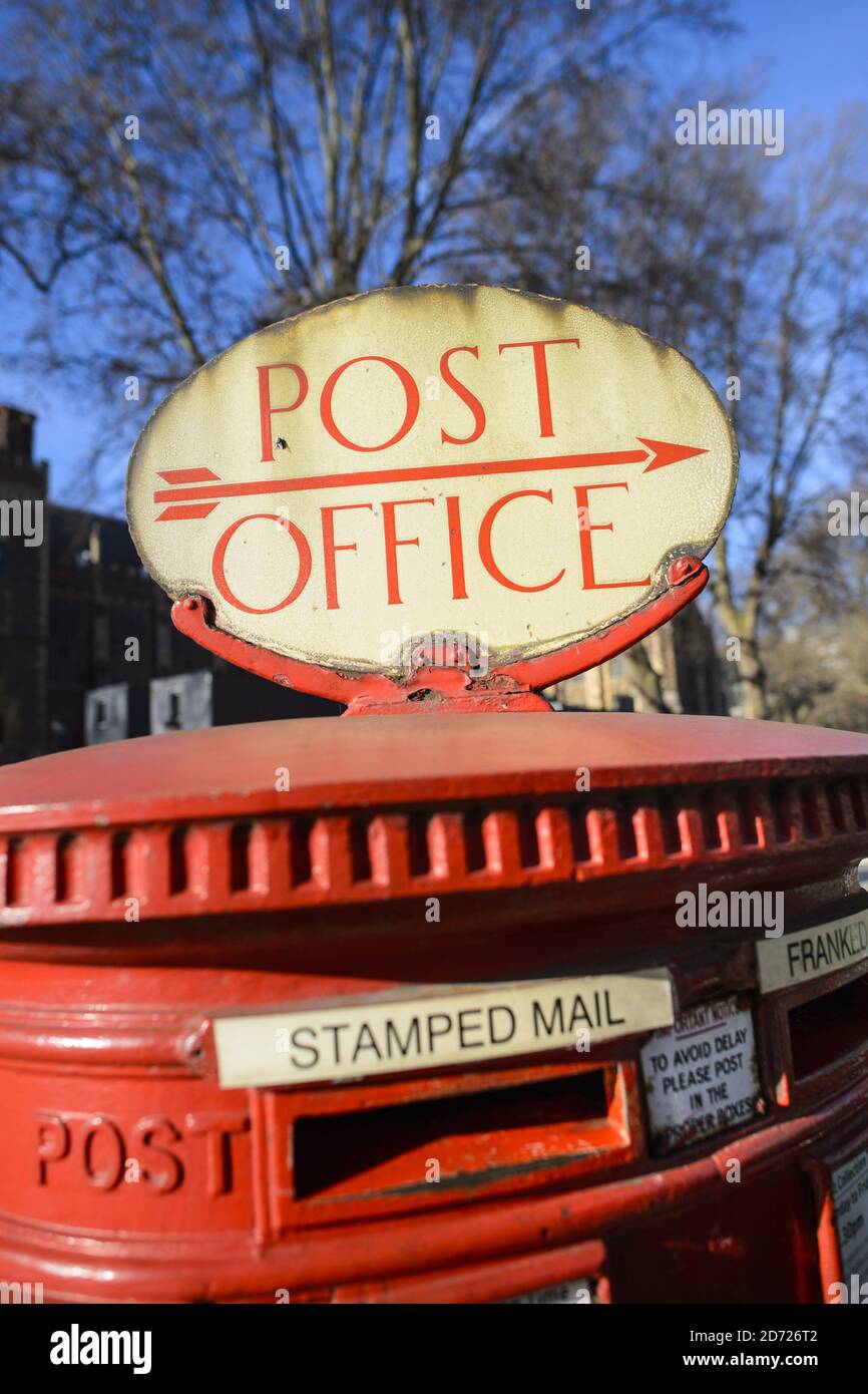 A letter box with a Post Office sign, in Lincoln's Inn fields, London. Up  to 60 Post Offices are set to be transferred to the private sector, which  along with job cuts