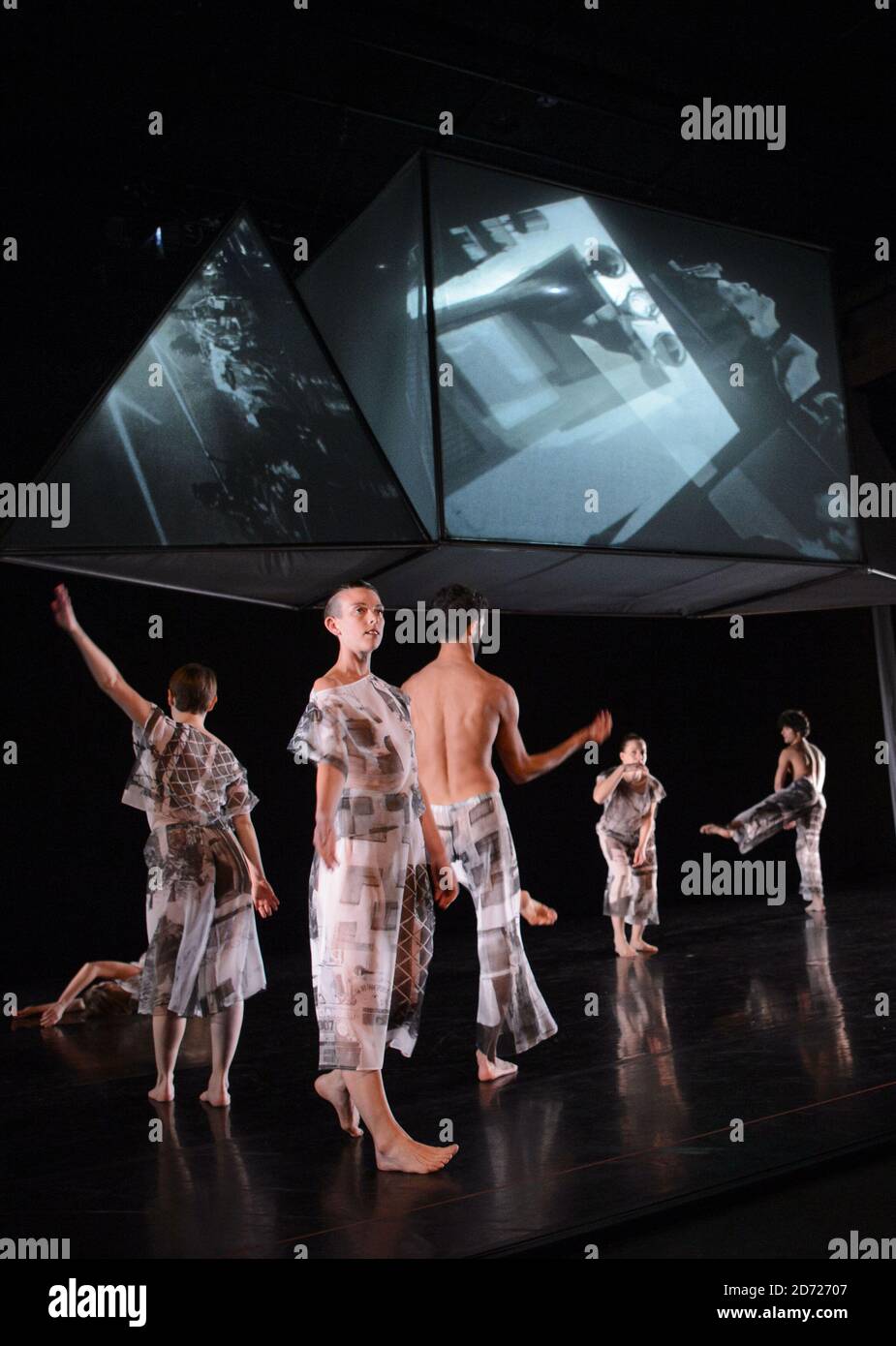 Dancers from the Trisha Brown Dance Company pictured during a dress rehearsal for Set and Reset, in the Tanks at Tate Modern, London. The piece will be staged on 27-28 January with original set and costumes created for them by Robert Rauschenberg in 1983, to coincide with a retrospective of the artist's work currently on display at the gallery. Picture date: Thursday January 26, 2016 Stock Photo