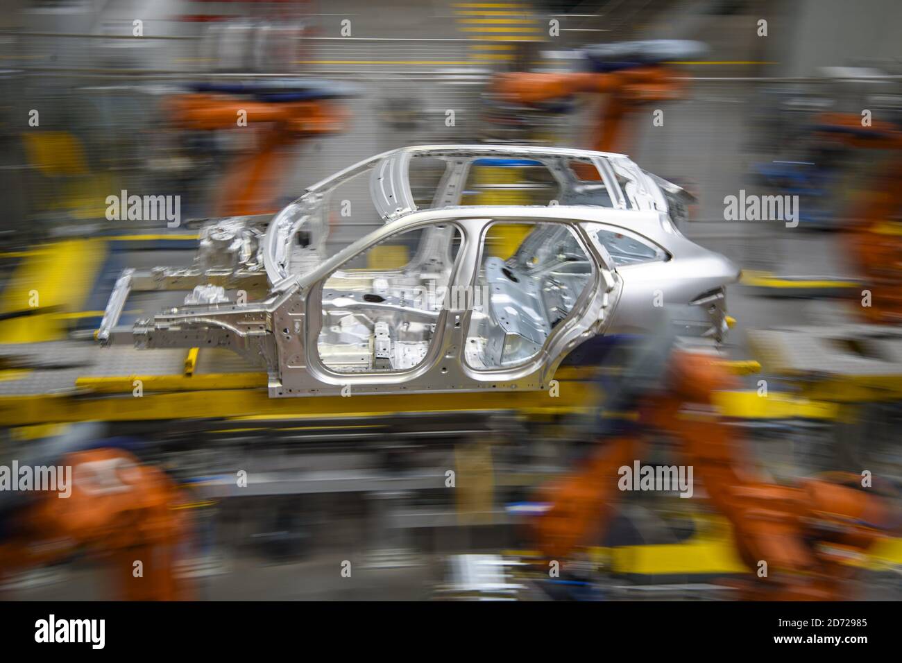 Cars being manufactured in the Aluminium Body Shop, part of Jaguar Land Rover's Advanced Manufacturing Facility in Solihull, Birmingham. Picture date: Wednesday March 15th, 2017. Photo credit should read: Matt Crossick/ EMPICS. Aluminium Body Shop 3 is Europe's largest aluminium body shop, and contains nearly 800 robots building Jaguar F-Pace and Range Rover Velar cars. It is capable of producing an aluminium car body every 76 seconds.  Stock Photo