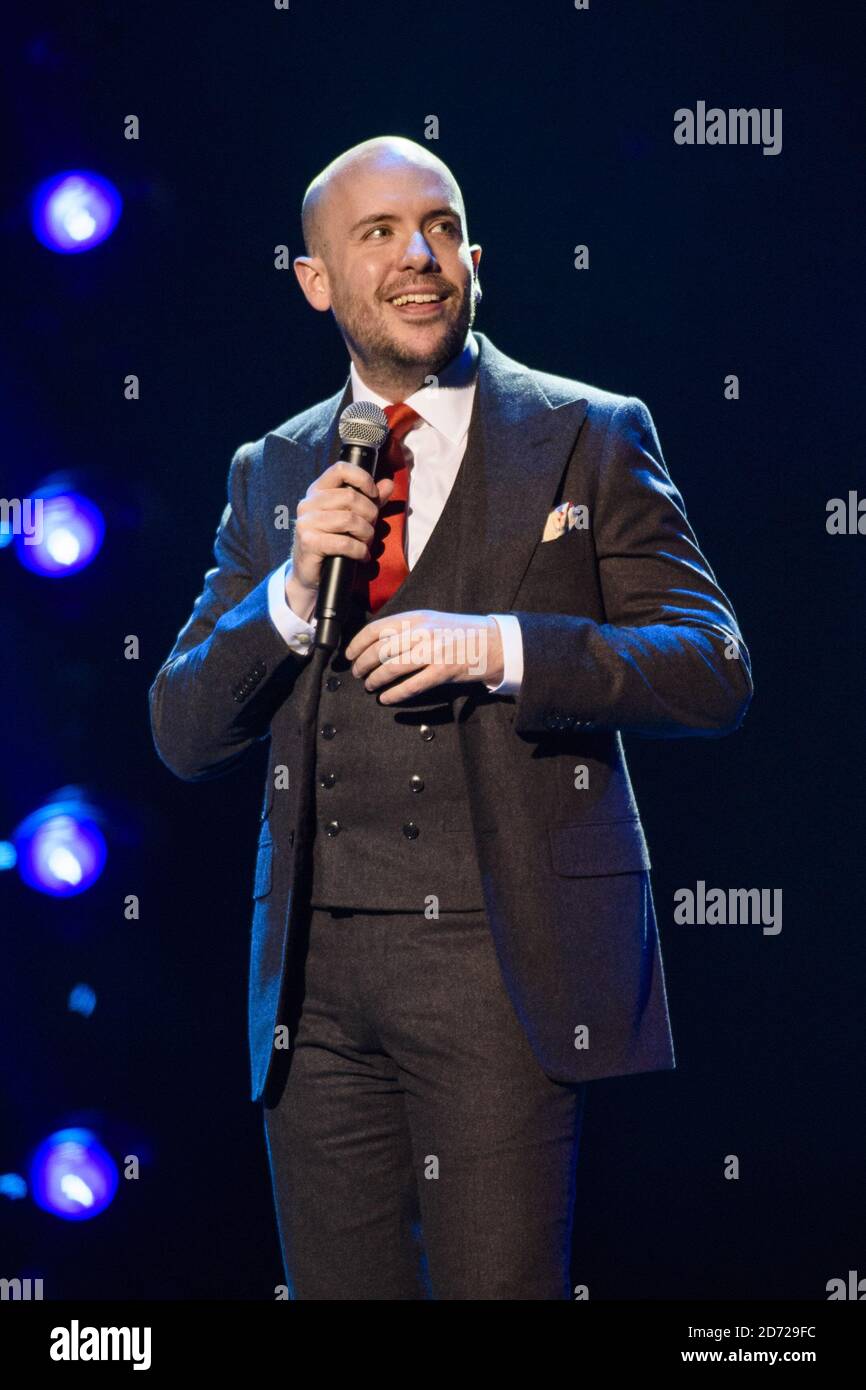 Tom Allen performing on stage at the Royal Albert Hall in London for
