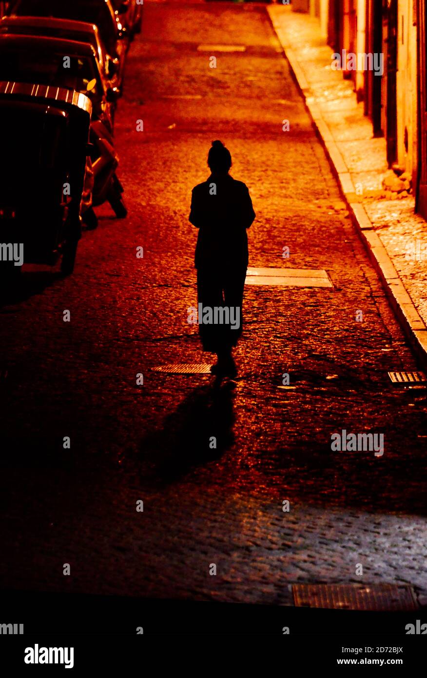 Woman alone at night in street hi-res stock photography and images - Alamy