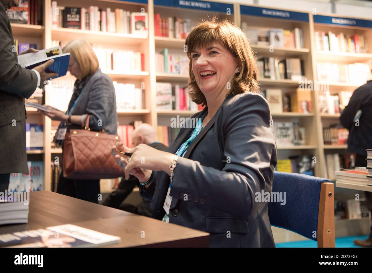 Nicky Morgan signs copies of her book at the Conservative Party Conference, at the Manchester Central Convention Complex in Manchester. Picture date: 2 October, 2017. Photo credit should read: Matt Crossick/ EMPICS Entertainment. Stock Photo