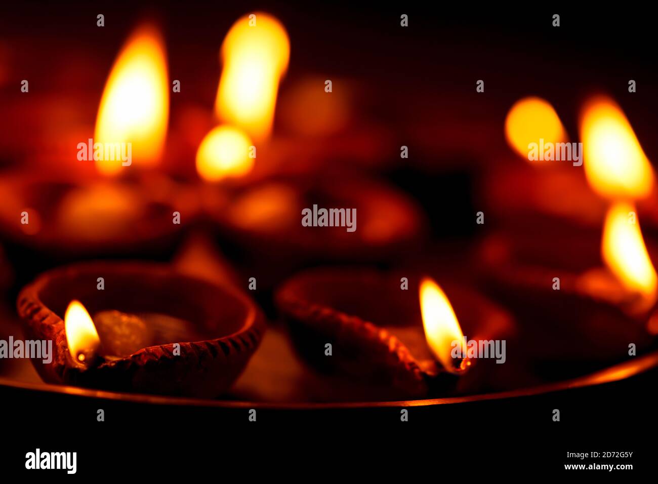 Happy Diwali Background with copy space. Clay diya or traditional oil lamps  lit or burning at night. Concept for greetings card, Indian hindu festival  Stock Photo - Alamy