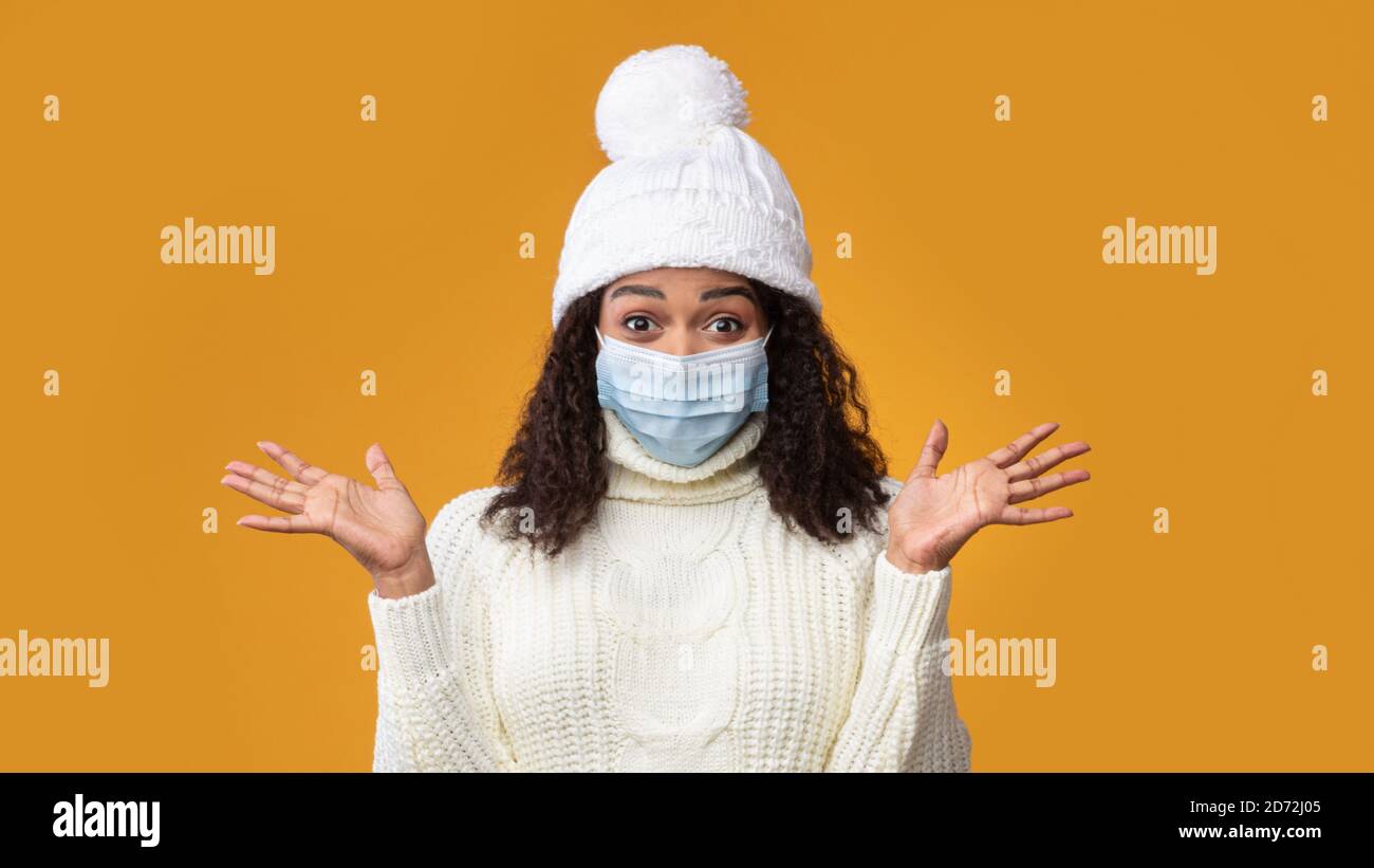 Portrait of black woman in medical mask showing clean hands Stock Photo ...
