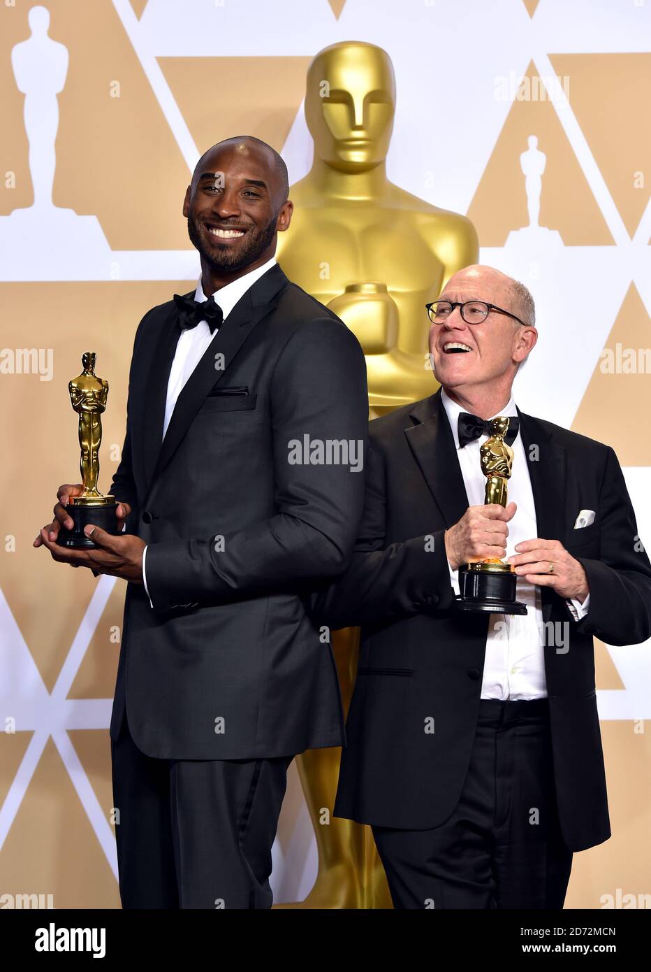 Kobe Bryant and Glen Keane with their Best animated short Oscar for