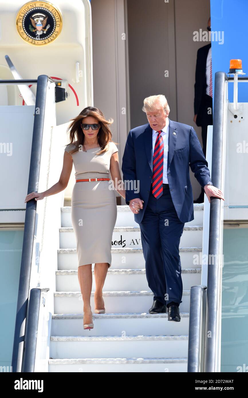 US President Donald Trump and his wife Melania walk down the steps from Air  Force One at Stansted Airport, ahead of his visit to the UK Stock Photo -  Alamy