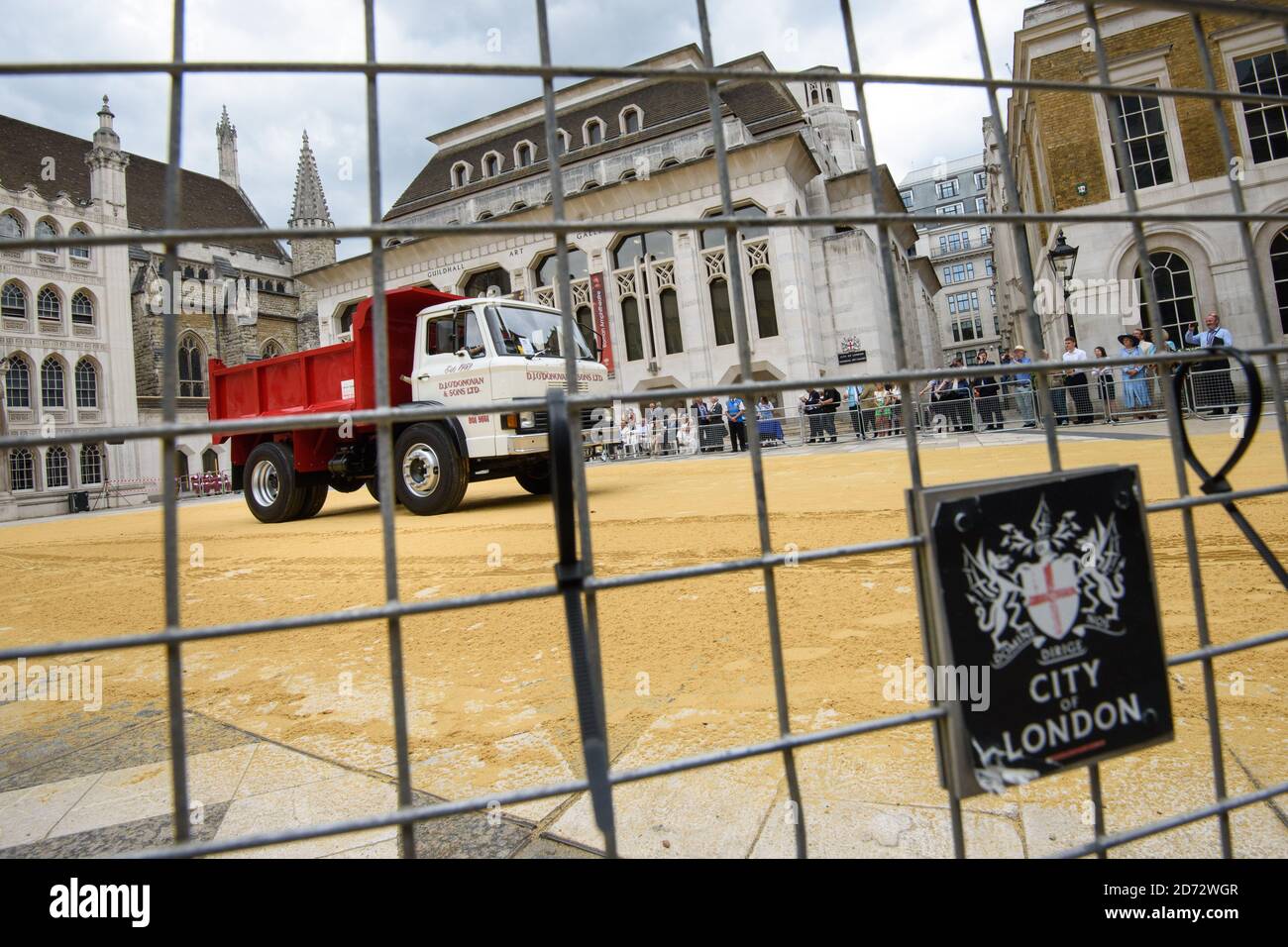 Members of the Worshipful Company of Carmen drive their historic carts and vehicles to Guildhall, in the City of London, for the annual Cart Marking Ceremony. The tradition, originating in the licensing of vehicles for hire in the 17th century, sees each vehicle branded with a letter to mark its official licensed status. Picture date: Wednesday July 18th, 2018. Photo credit should read: Matt Crossick/ EMPICS Entertainment. Stock Photo