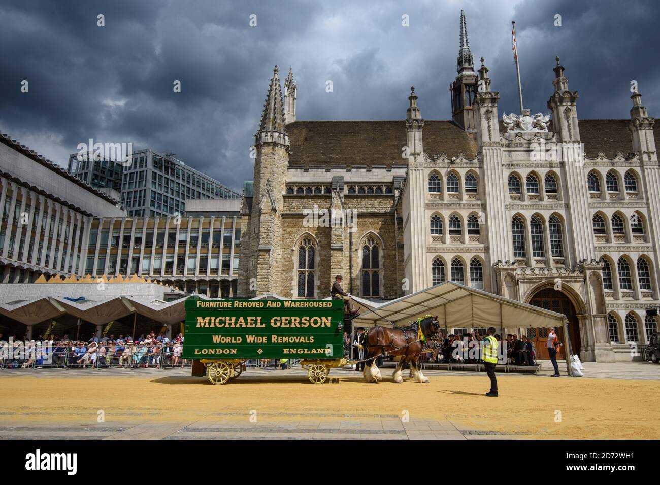 Members of the Worshipful Company of Carmen drive their historic carts and vehicles to Guildhall, in the City of London, for the annual Cart Marking Ceremony. The tradition, originating in the licensing of vehicles for hire in the 17th century, sees each vehicle branded with a letter to mark its official licensed status. Picture date: Wednesday July 18th, 2018. Photo credit should read: Matt Crossick/ EMPICS Entertainment. Stock Photo