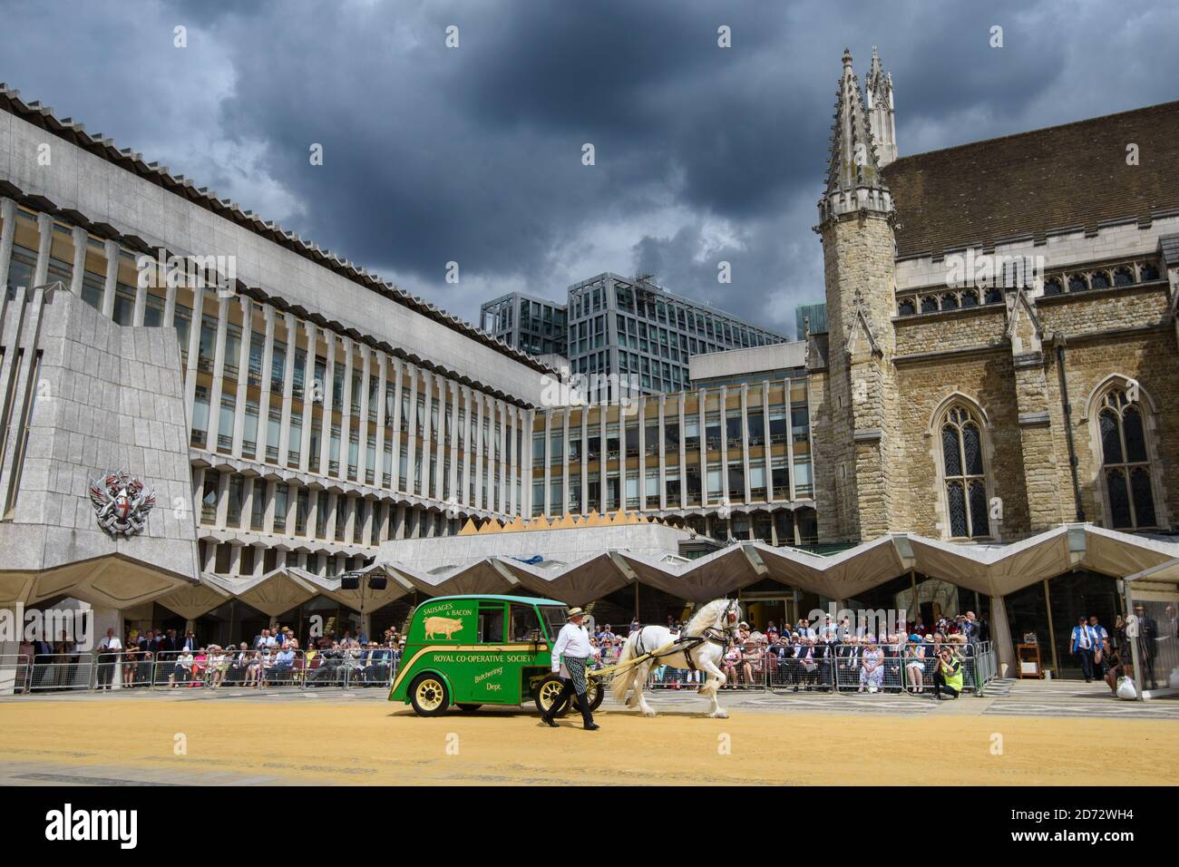 Members of the Worshipful Company of Carmen drive their historic carts and vehicles to Guildhall, in the City of London, for the annual Cart Marking Ceremony. The tradition, originating in the licensing of vehicles for hire in the 17th century, sees each vehicle branded with a letter to mark its official licensed status. Picture date: Wednesday July 18th, 2018. Photo credit should read: Matt Crossick/ EMPICS Entertainment. Stock Photo