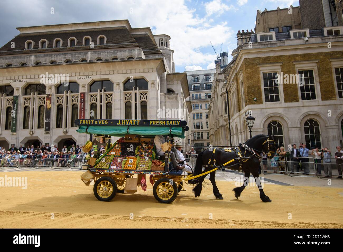 Members of the Worshipful Company of Carmen drive their historic carts and vehicles to Guildhall, in the City of London, for the annual Cart Marking Ceremony. The tradition, originating in the licensing of vehicles for hire in the 17th century, sees each vehicle branded with a letter to mark its official licensed status. Picture date: Wednesday July 18th, 2018. Photo credit should read: Matt Crossick/ EMPICS Entertainment. Stock Photo