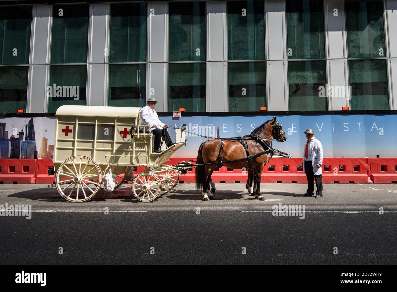 Members of the Worshipful Company of Carmen drive their historic carts and vehicles to Guildhall, in the City of London, for the annual Cart Marking Ceremony. The tradition, originating in the licensing of vehicles for hire in the 17th century, sees each vehicle branded with a letter to mark its official licensed status. Picture date: Wednesday July 18th, 2018. Photo credit should read: Matt Crossick/ EMPICS Entertainment. Stock Photo