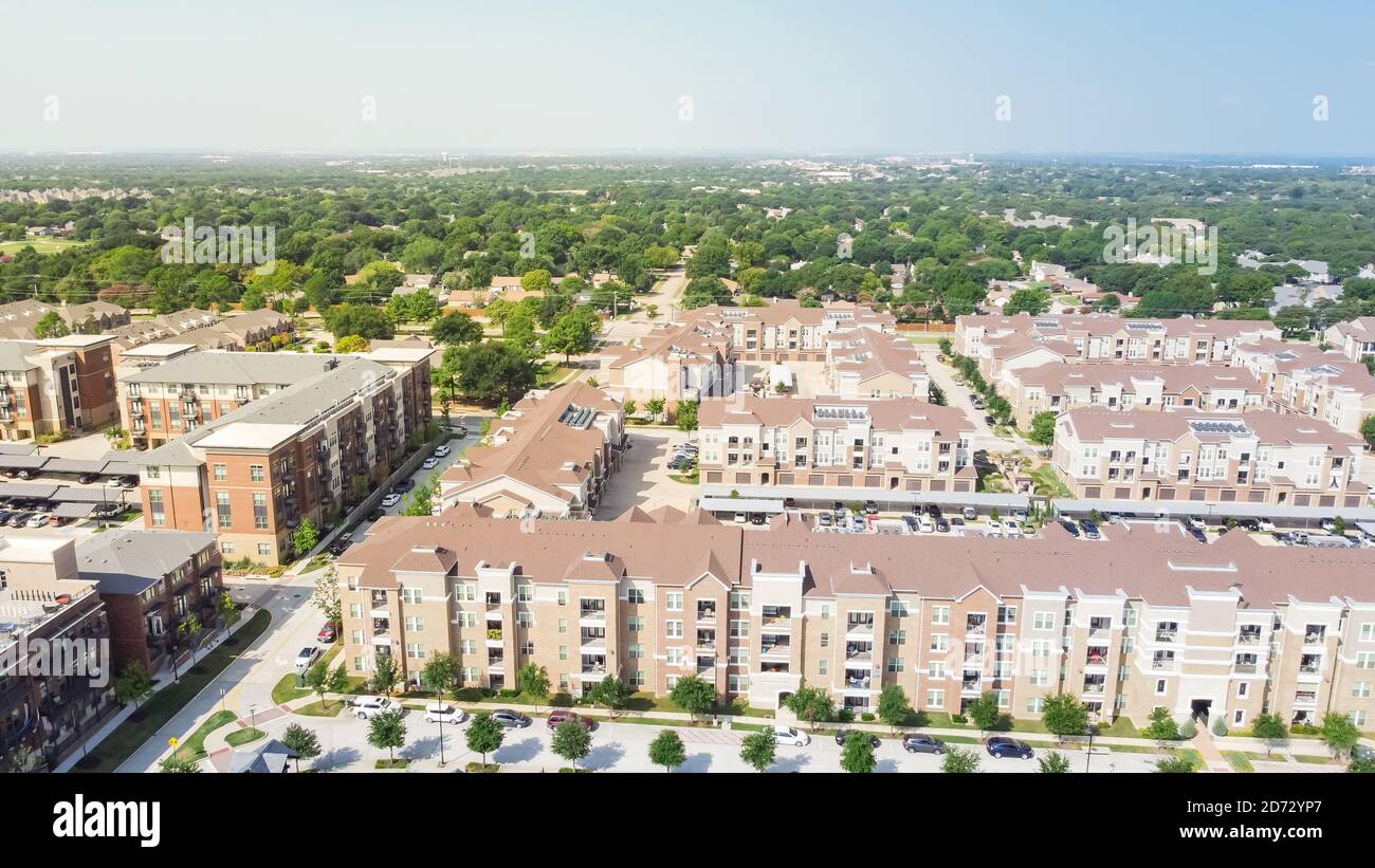 Aerial view multistory apartment complex and suburban residential area
