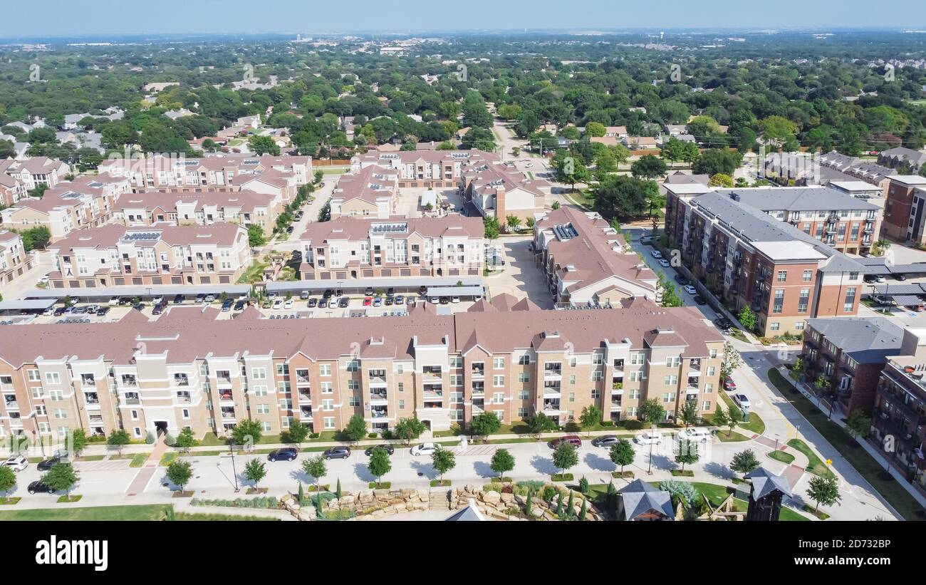 Aerial view multistory apartment complex and suburban residential area