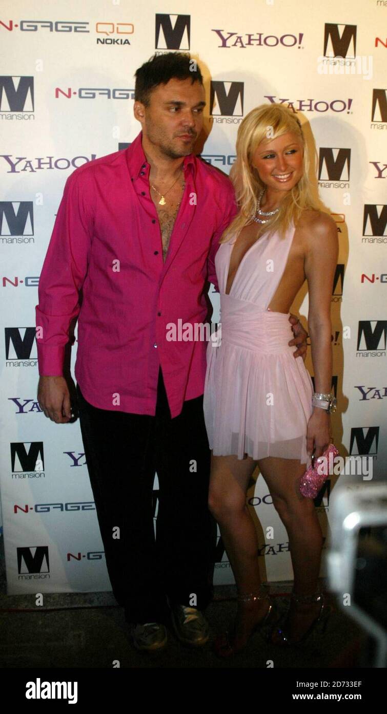 Paris Hilton with David Lachappelle at her "Screwed" album launch party held at Mansion Miami beach 8/28/04  [[sah]] Stock Photo