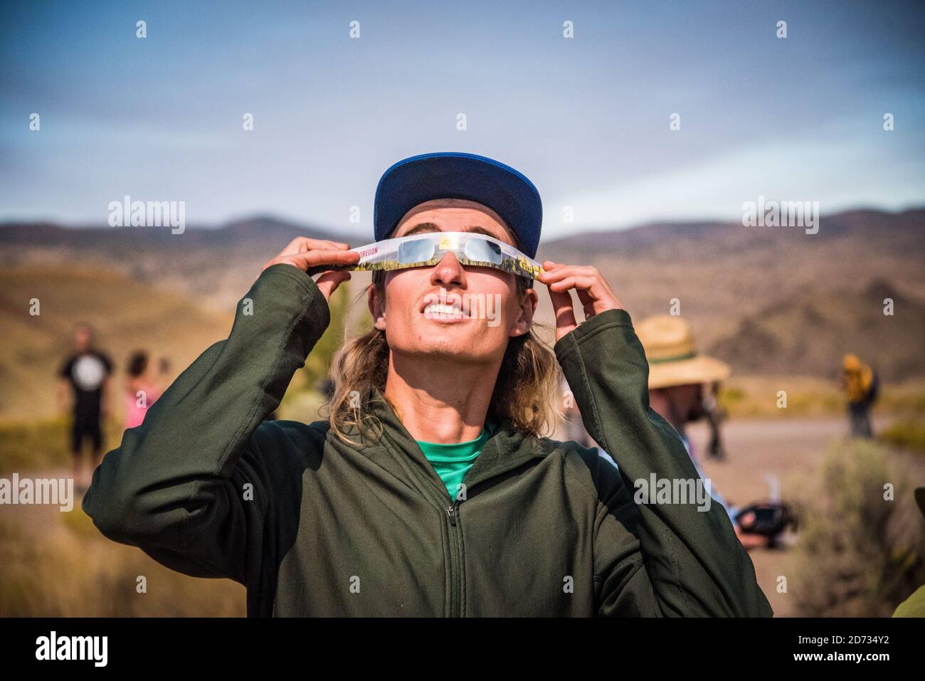 Eye protection during Total solar eclipse 2017, in the Painted Hills, in eastern Oregon,USA,   John Day Fossil Beds National Monument Stock Photo