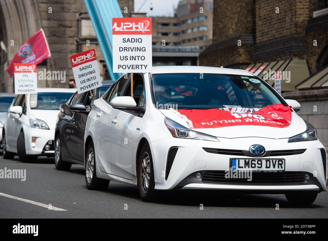 Private hire cars disrupt traffic on Tower Bridge, London, during a protest organised by United Private Hire Drivers, against the increased London congestion charge of Â£15 a day. Picture date: Tuesday July 28, 2020. Photo credit should read: Matt Crossick/Empics Stock Photo