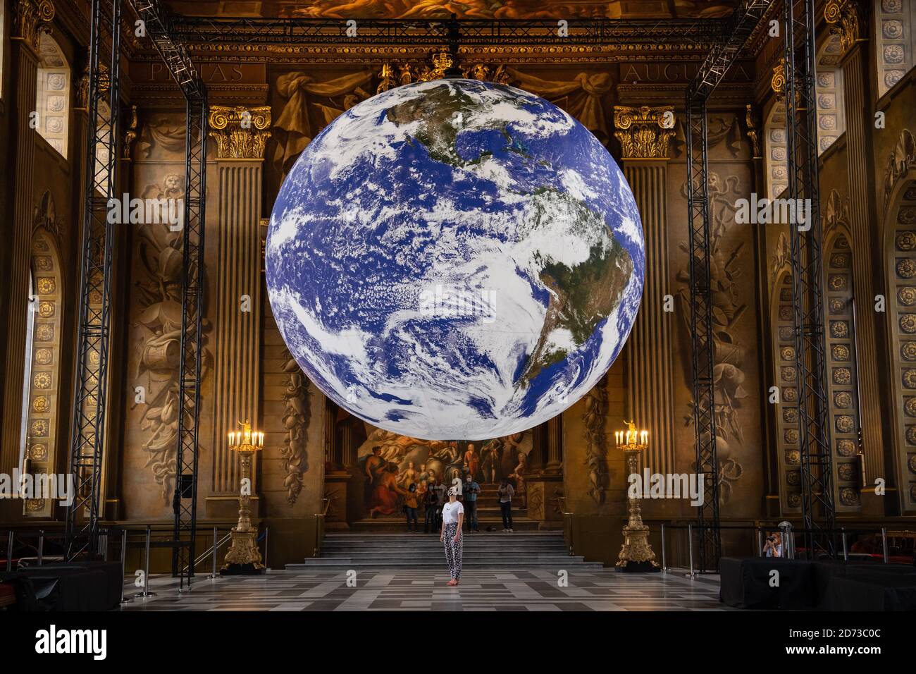 Luke Jerram's artwork Gaia, a replica of planet earth created using detailed NASA imagery of the Earth's surface, goes on display in the Painted Hall of the Old Royal Naval College, Greenwich, London, as part of the 2020 Greenwich+Docklands International Festival. Picture date: Friday August 28, 2020. Photo credit should read: Matt Crossick/Empics Stock Photo