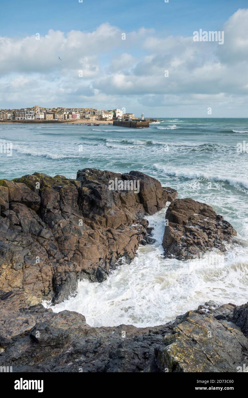 Rough winter seas hitting the harbour in St Ives, Cornwall, UK Stock Photo