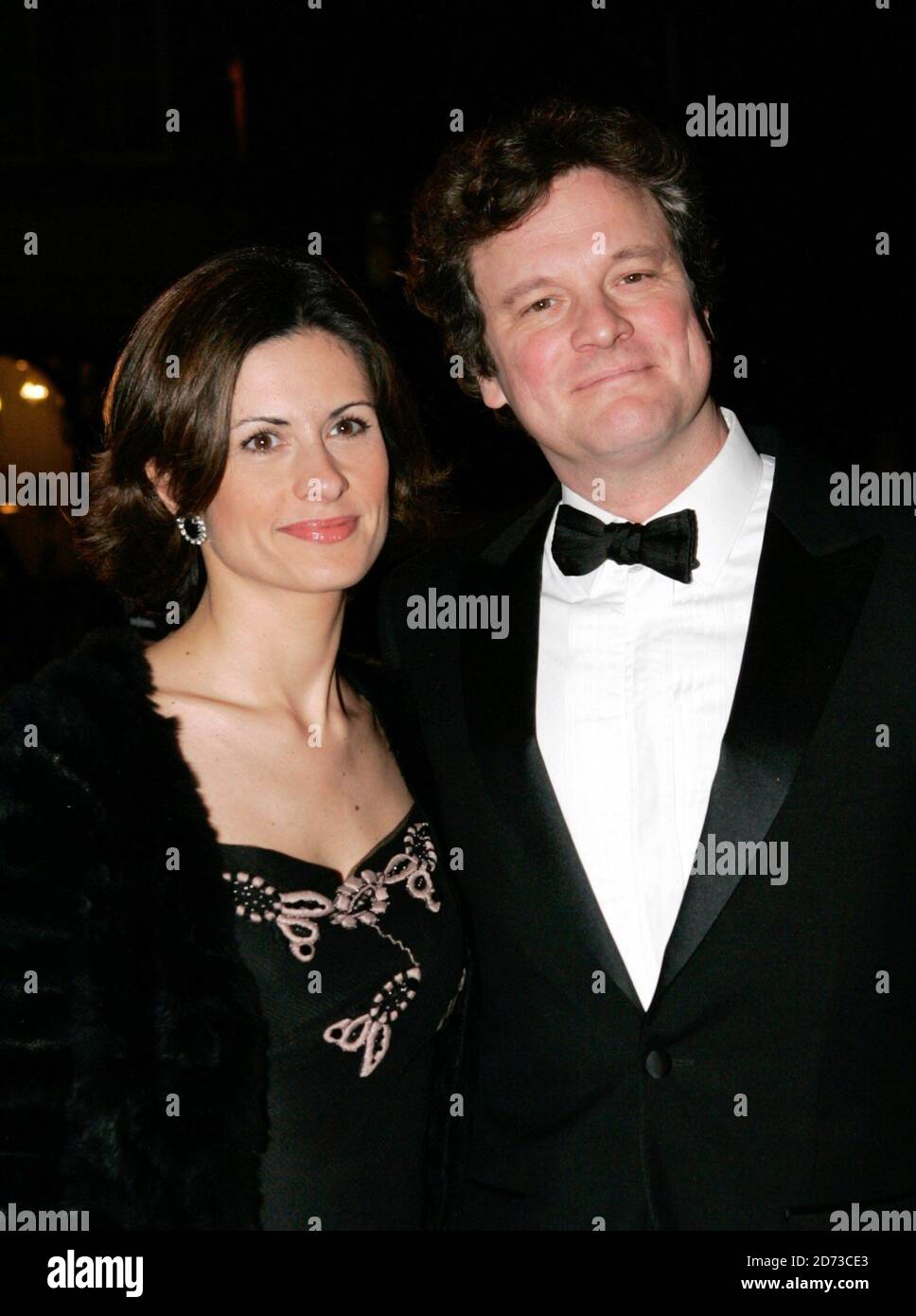 Feb. 27, 2011 - Hollywood, California, U.S. - Actor COLIN FIRTH wearing a Tom  Ford tuxedo and wife LIVIA GIUGGIOLI wearing a panelled gown recycled from  old dresses for the red carpet