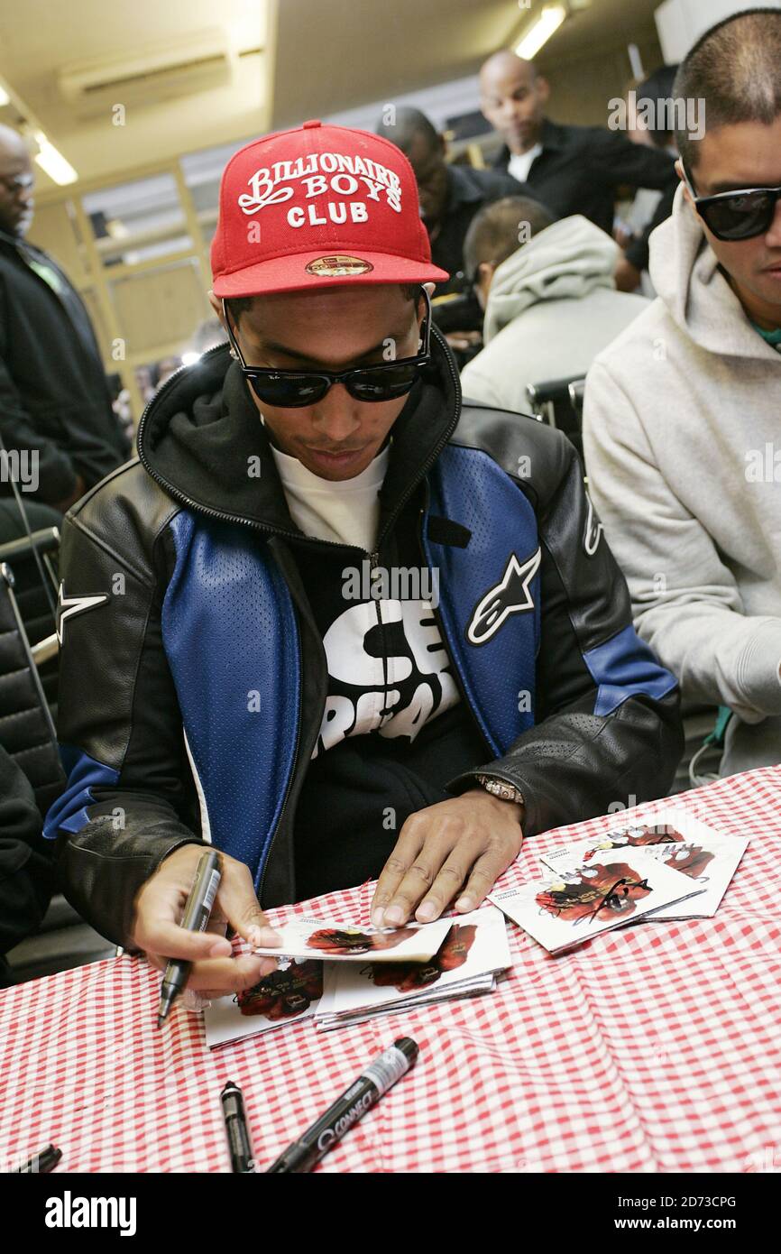 Pharrell Williams of N.E.R.D signs copies of new album Seeing Sounds at the Hideout store in Soho, London. Stock Photo