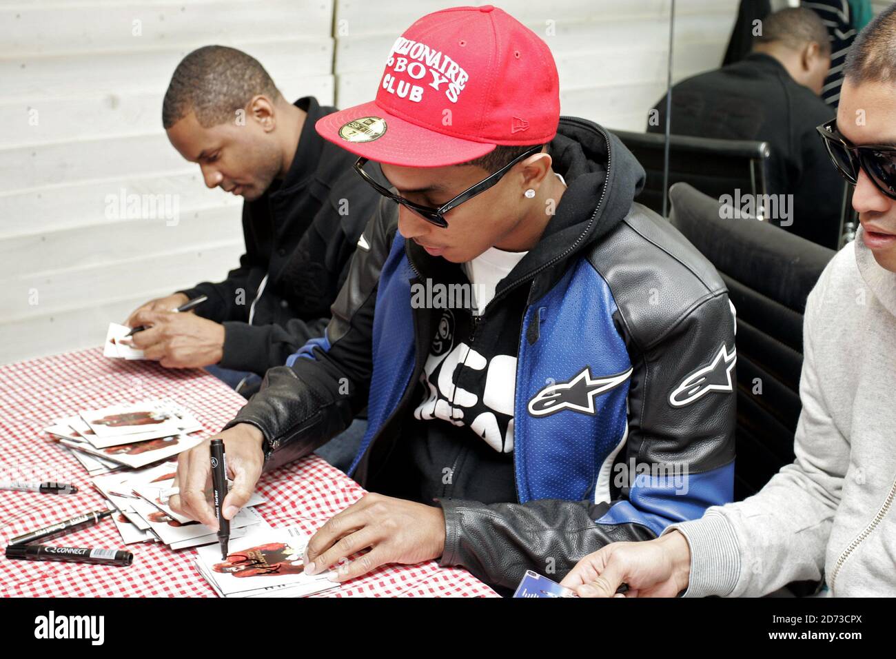 Pharrell Williams of N.E.R.D signs copies of new album Seeing Sounds at the Hideout store in Soho, London. Stock Photo