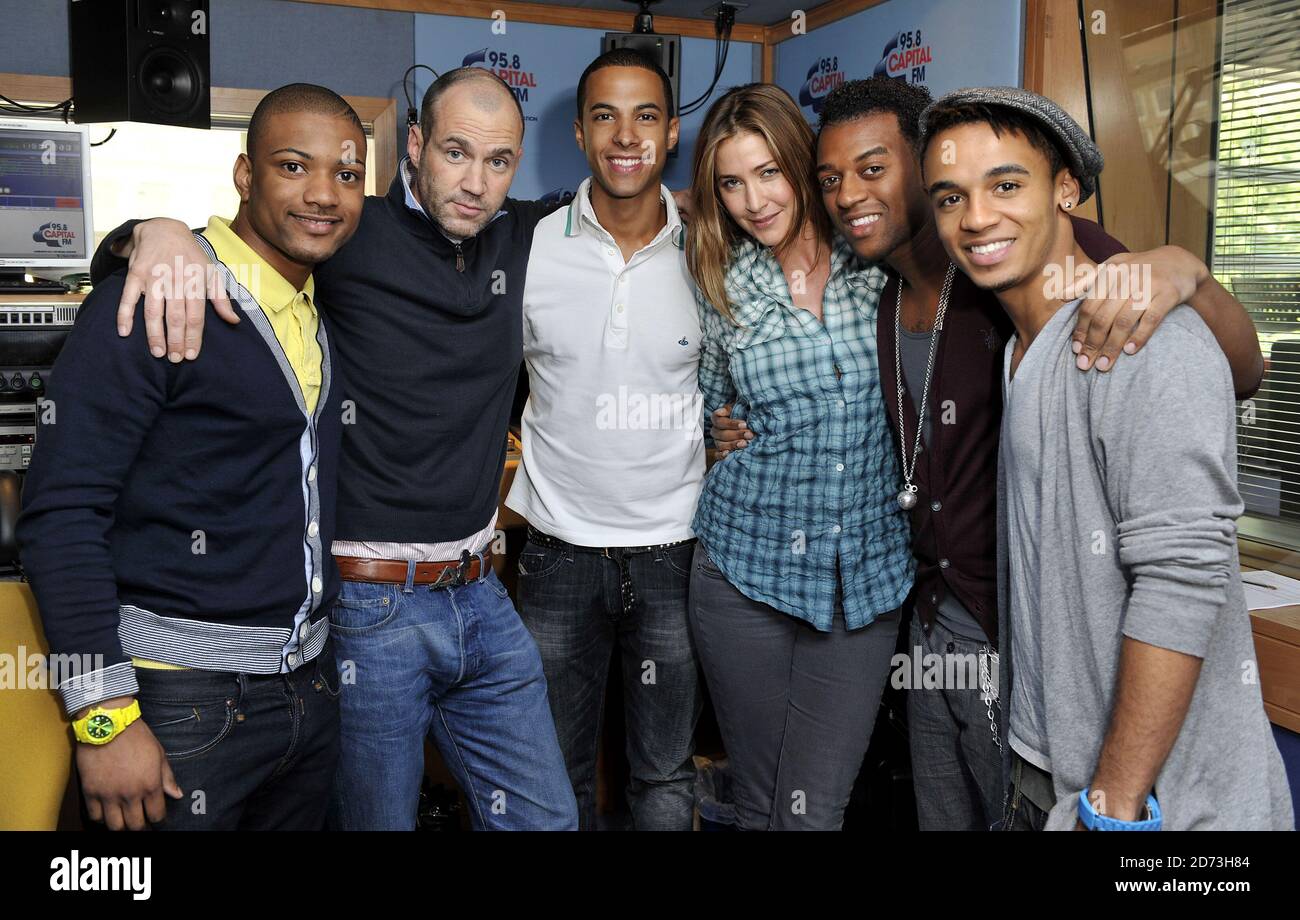 (L-R) Jonathan Gill, Johnny Vaughn, Marvin Humes, Lisa Snowdon,  Oritse Williams, and Aston Merrygold of JLS are interviewed on the Capital Radio breakfast show, at the Global Radio studios in central London Stock Photo