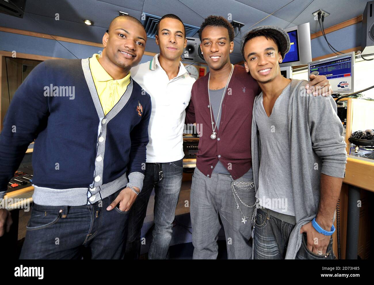 (L-R) Jonathan Gill, Marvin Humes, Oritse Williams, and Aston Merrygold of JLS are interviewed on the Capital Radio breakfast show, at the Global Radio studios in central London Stock Photo