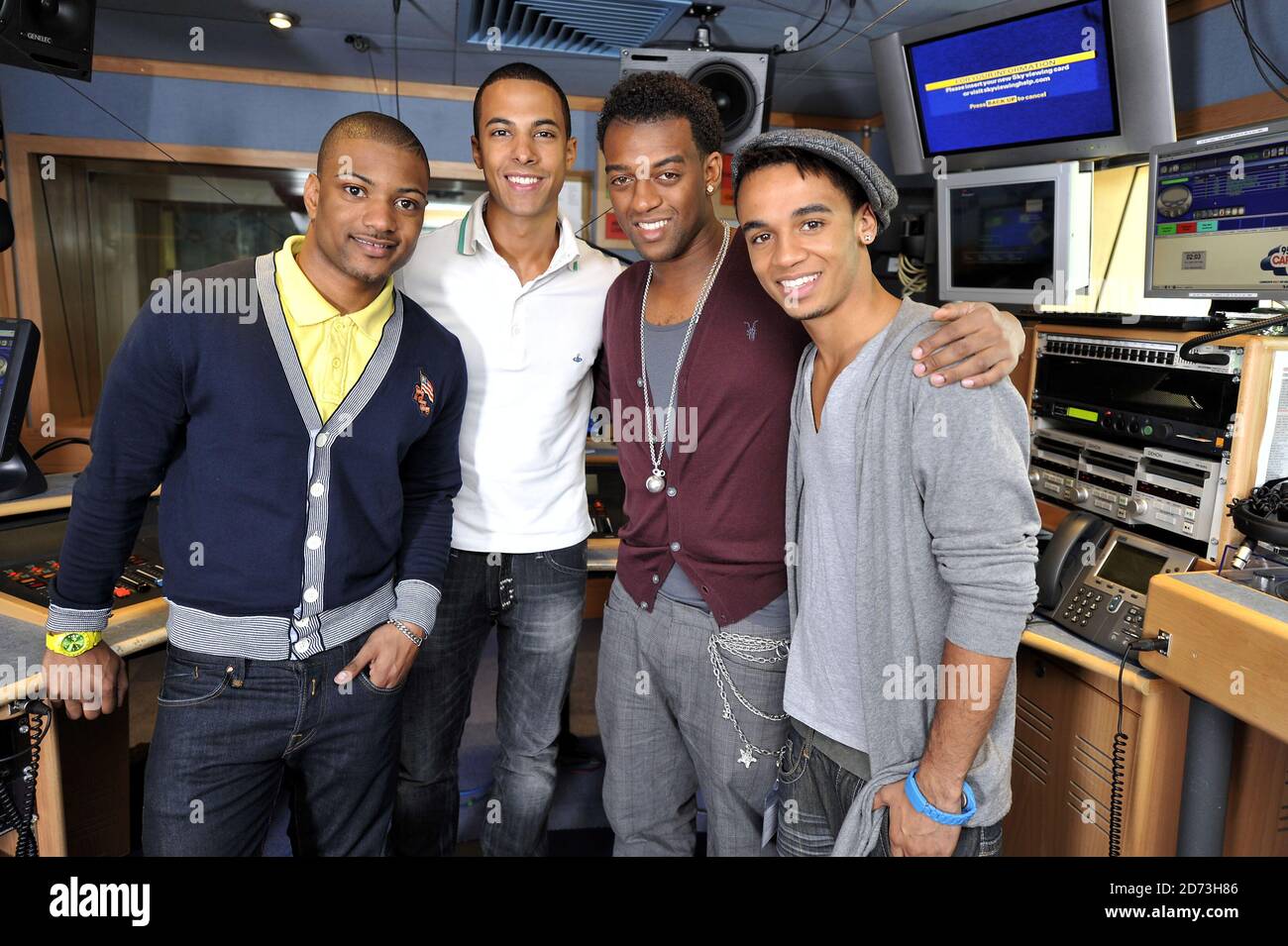 (L-R) Jonathan Gill, Marvin Humes, Oritse Williams, and Aston Merrygold of JLS are interviewed on the Capital Radio breakfast show, at the Global Radio studios in central London Stock Photo