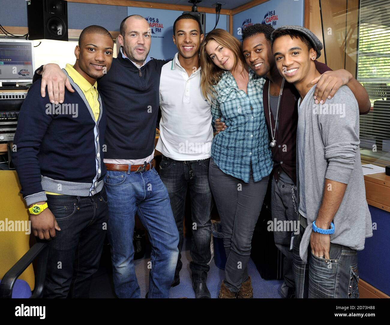 (L-R) Jonathan Gill, Johnny Vaughn, Marvin Humes Lisa Snowdon,  Oritse Williams, and Aston Merrygold of JLS are interviewed on the Capital Radio breakfast show, at the Global Radio studios in central London Stock Photo