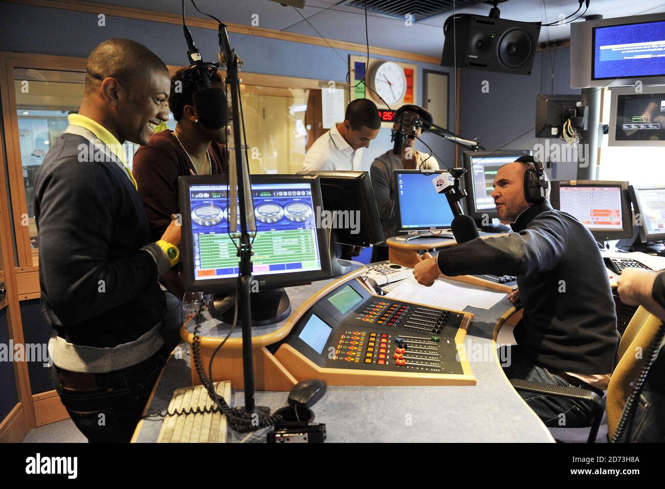 (L-R) Jonathan Gill, Oritse Williams, Marvin Humes and Aston Merrygold JLS are interviewed by Johnny Vaughn and Lisa Snowdon (not pictured)  on the Capital Radio breakfast show, at the Global Radio studios in central London Stock Photo