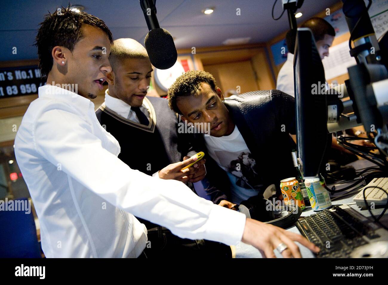 JLS on air while co-hosting a show on Capital FM, at the Global Radio  studios in central London Stock Photo - Alamy