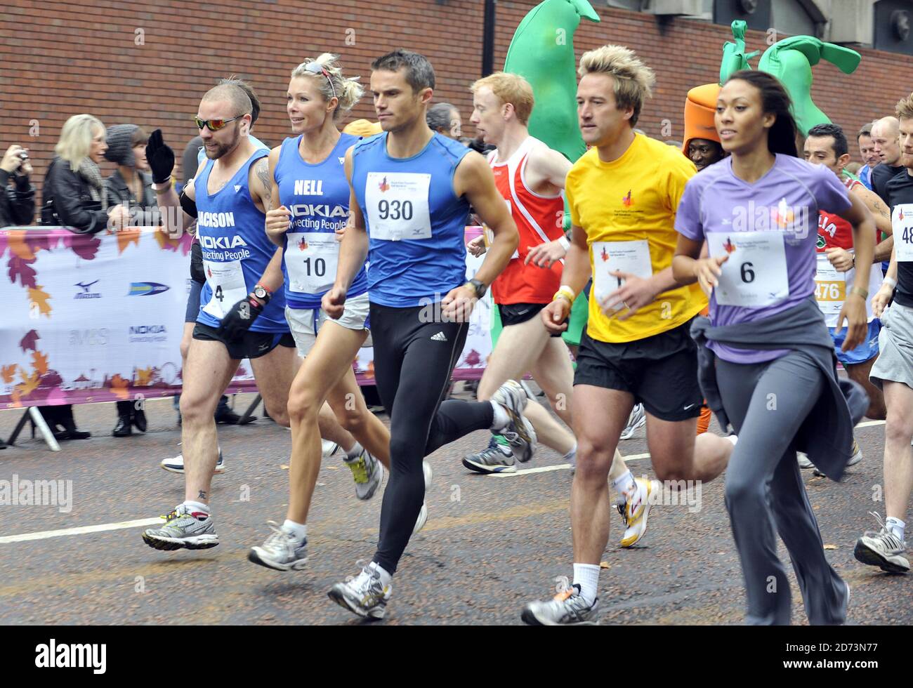 Runners including Greg Burns, Nell McAndrew, Ben Fogle and Rachel Christie start the Royal Parks Foundation Half Marathon, in Hyde Park in central London Stock Photo