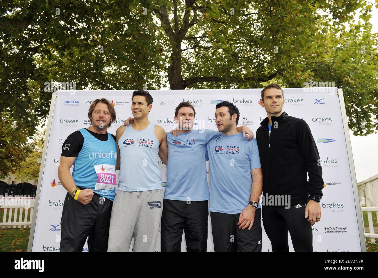 (l-r) Charley Boorman, Jeremy Edwards, Greg Burns, Antony Costa and Matt Roberts seen at the start of the Royal Parks FOundation Half Marathon, in Hyde Park in central London Stock Photo