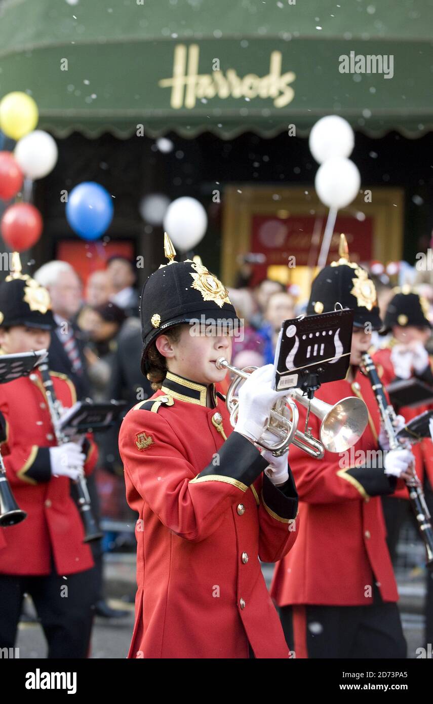 Crowds watch the Harrods Christmas parade in Knightsbridge, west London