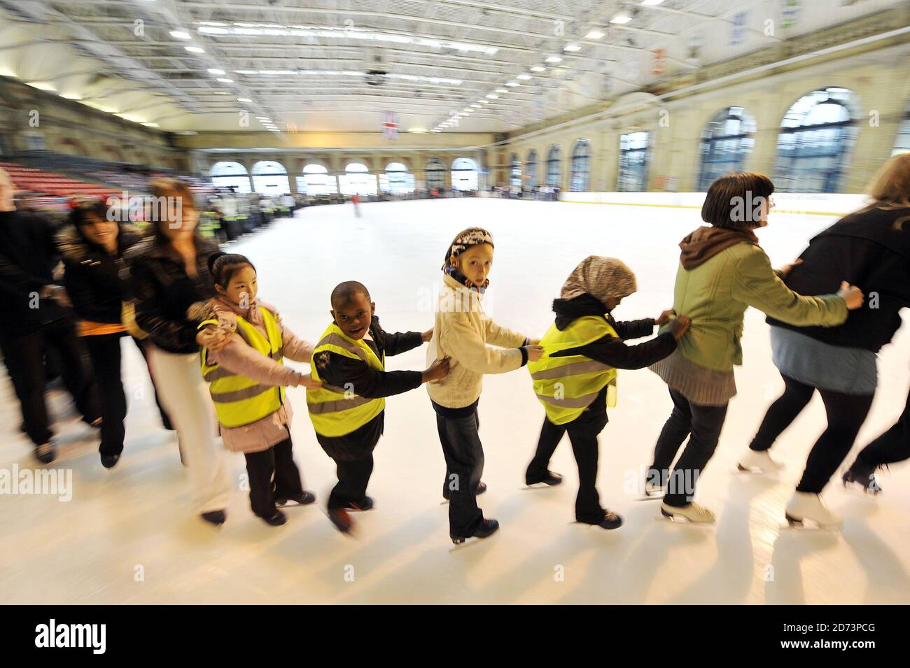 Skaters participate in a recordbreaking attempt to make the longest