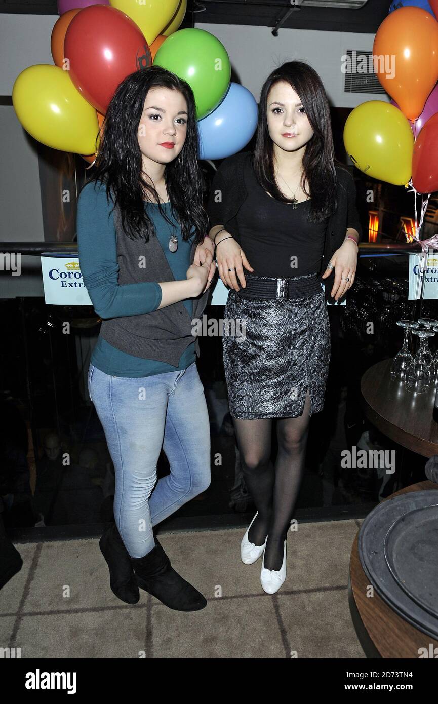 Kathryn (l) and Megan Prescott attend the Planet Hollywood Super Bowl XLIV party in central London Stock Photo