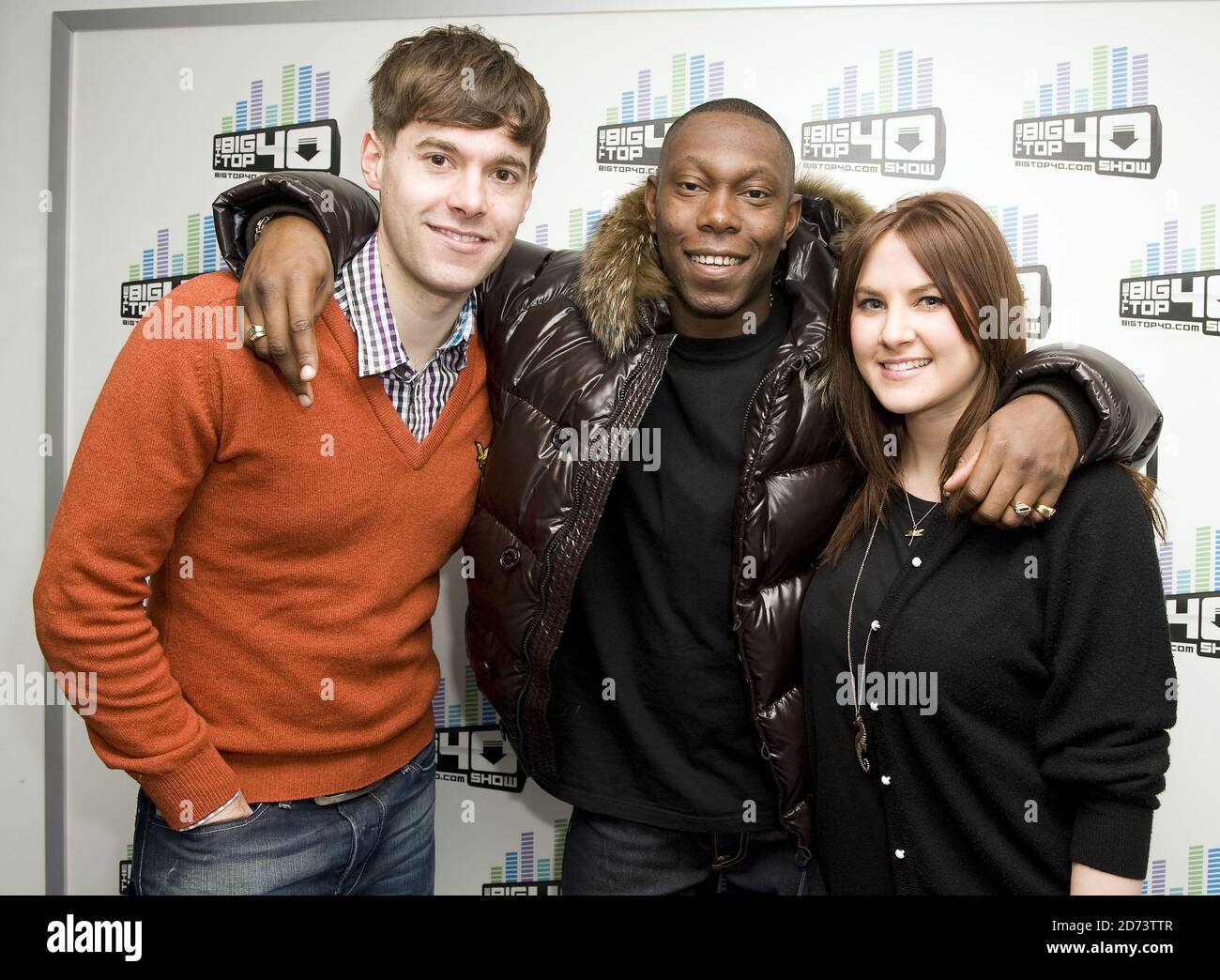 Dizzee Rascal poses for photographs with presenters Rich Clarke and Kat